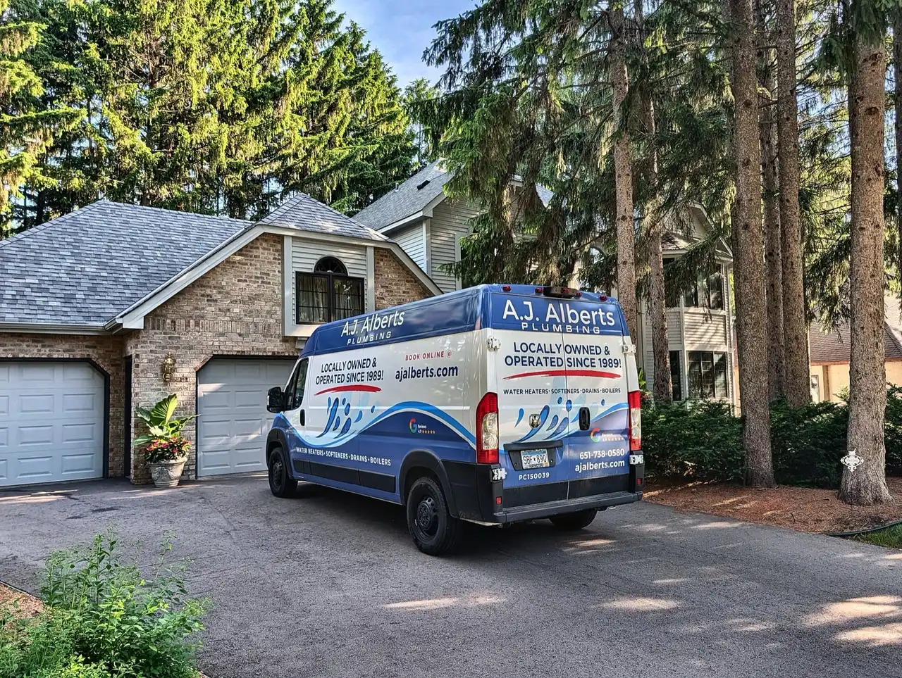 A.J. Alberts Plumbing service van at a Twin Cities home, locally owned and operated since 1989