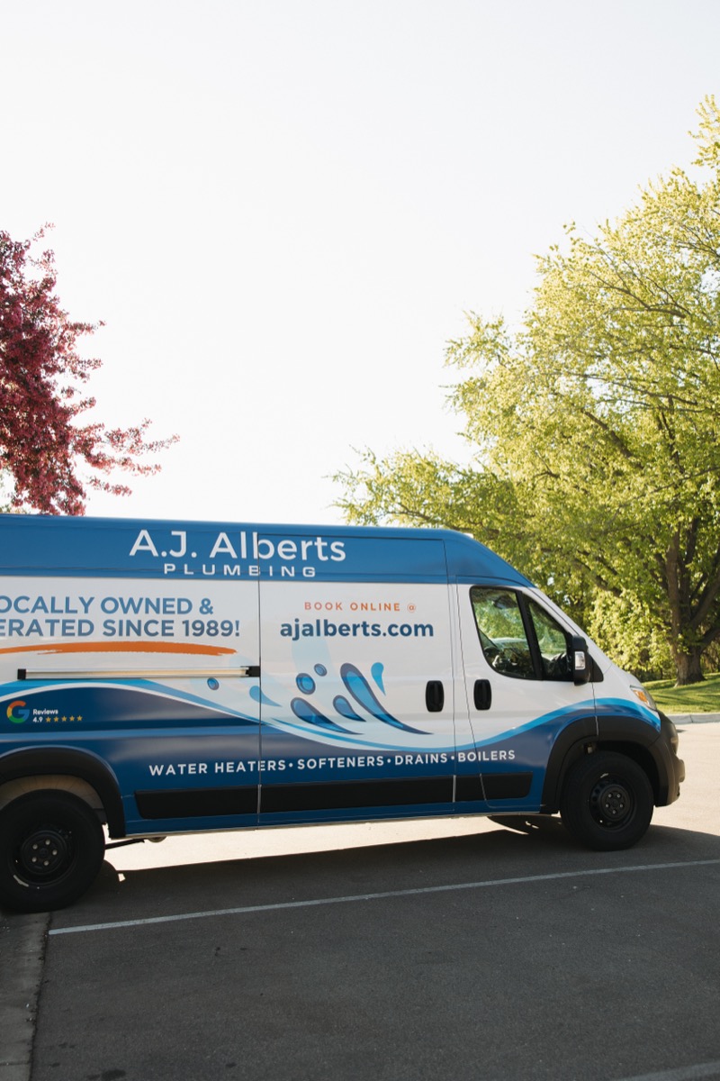 A.J. Alberts Plumbing service van parked outside on a spring morning in the Twin Cities