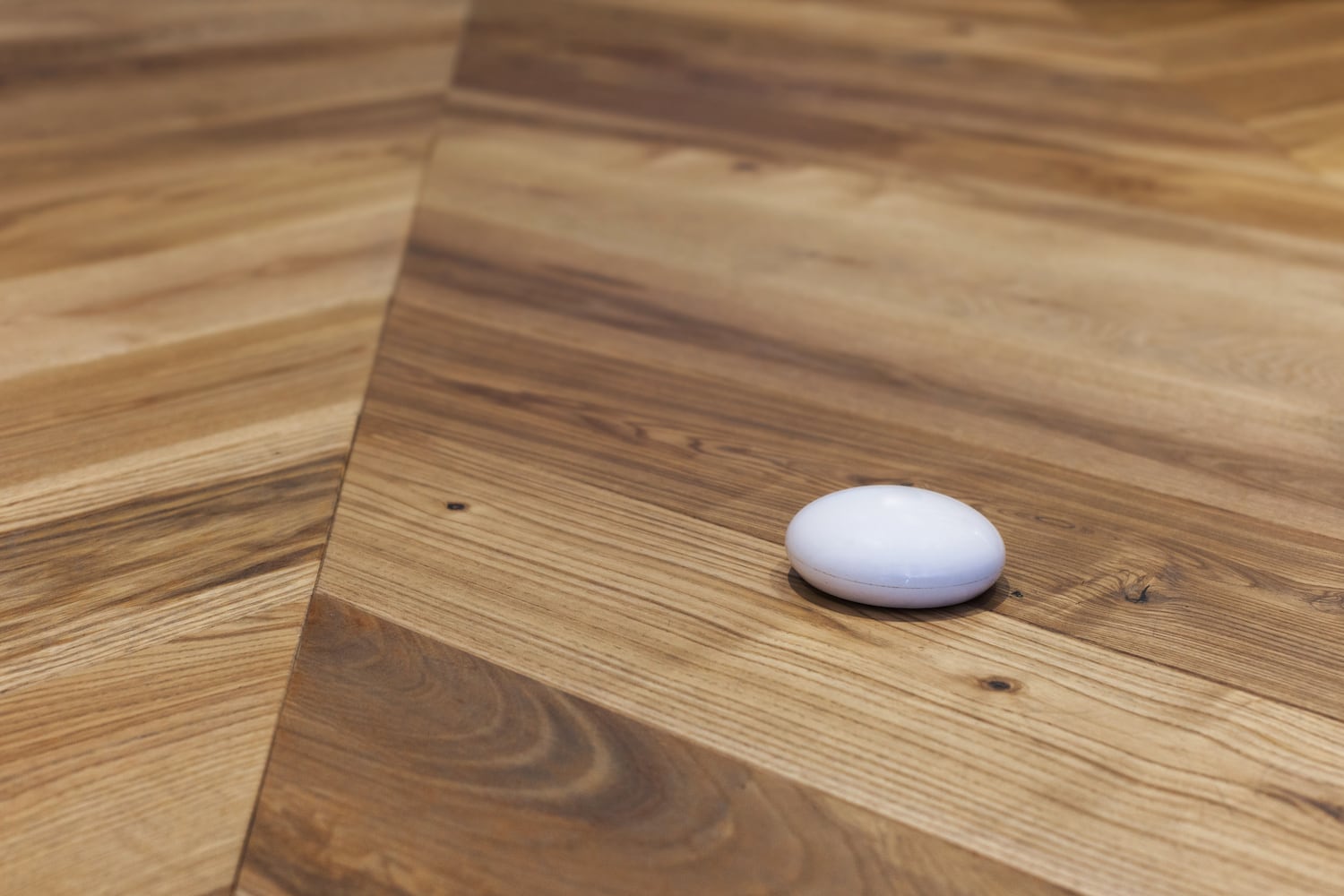 water leak detector sensor on wood floor