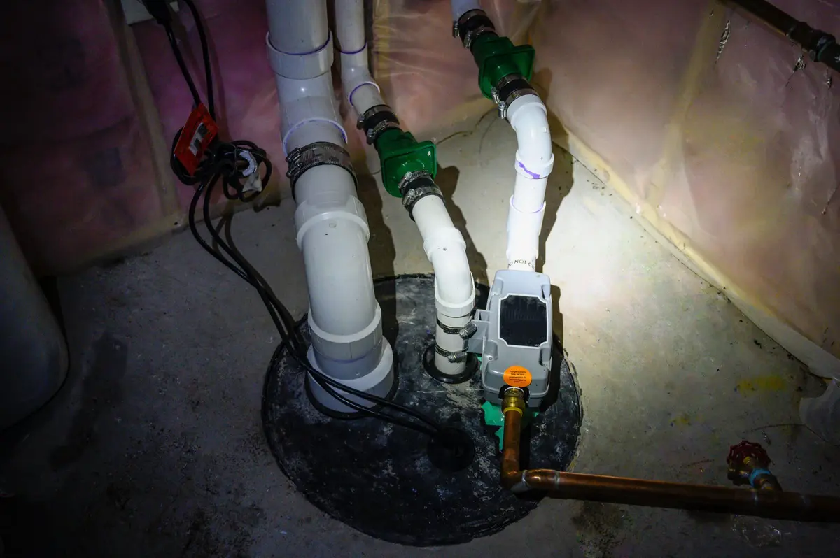 sump pump maintenance being performed