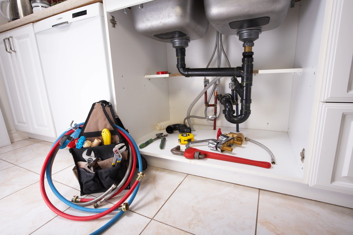 homeowner's plumbing tools in the kitchen