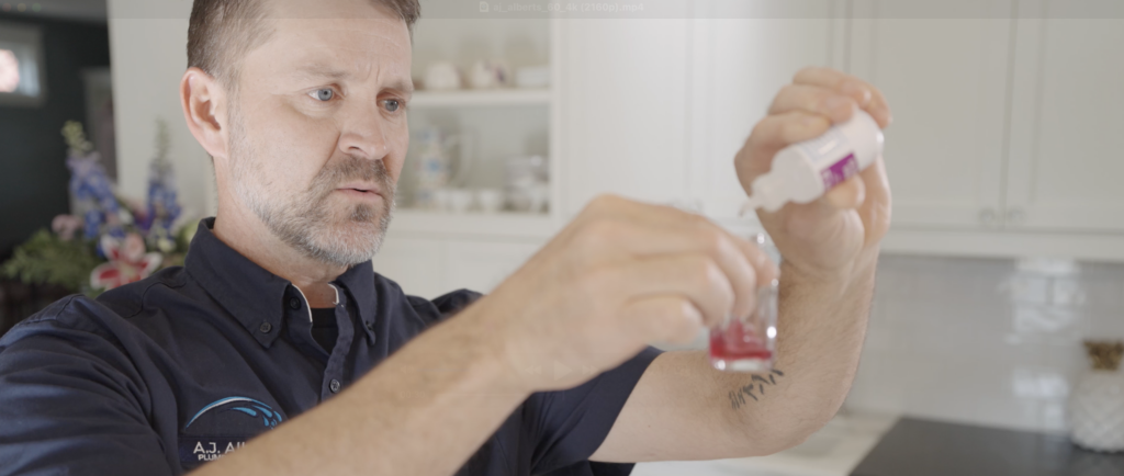 An A.J. Alberts water softener technician performs a water quality test.