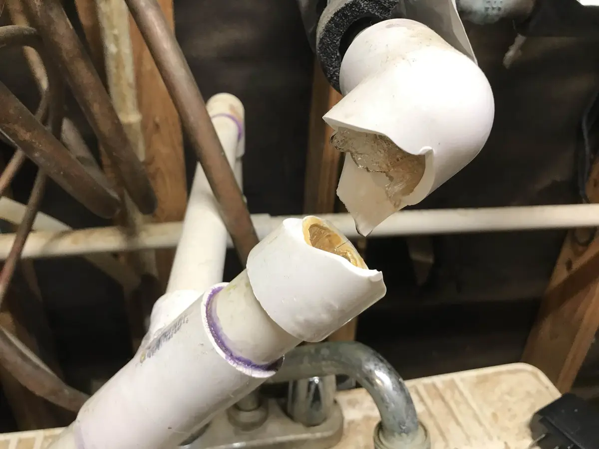 bursted PVC pipes with ice inside of them