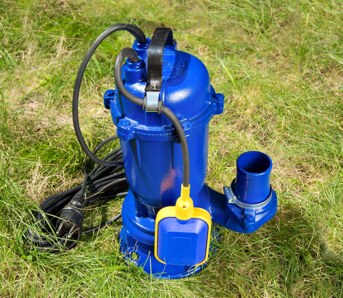 blue sump pump on ground