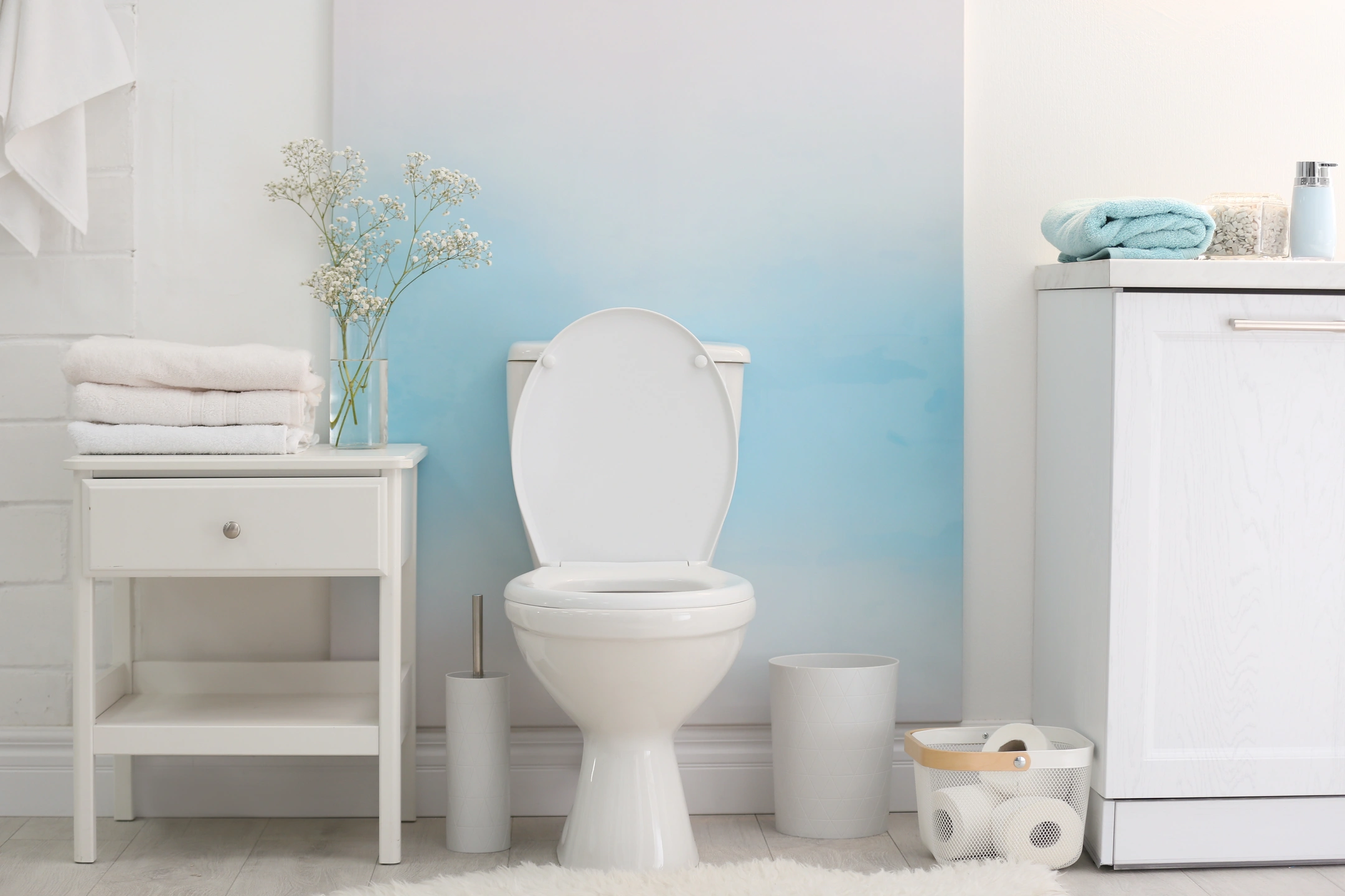 kohler ceramic toilets installed in white bathroom