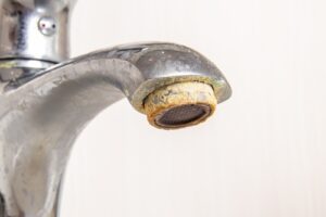 A faucet with mineral buildup.