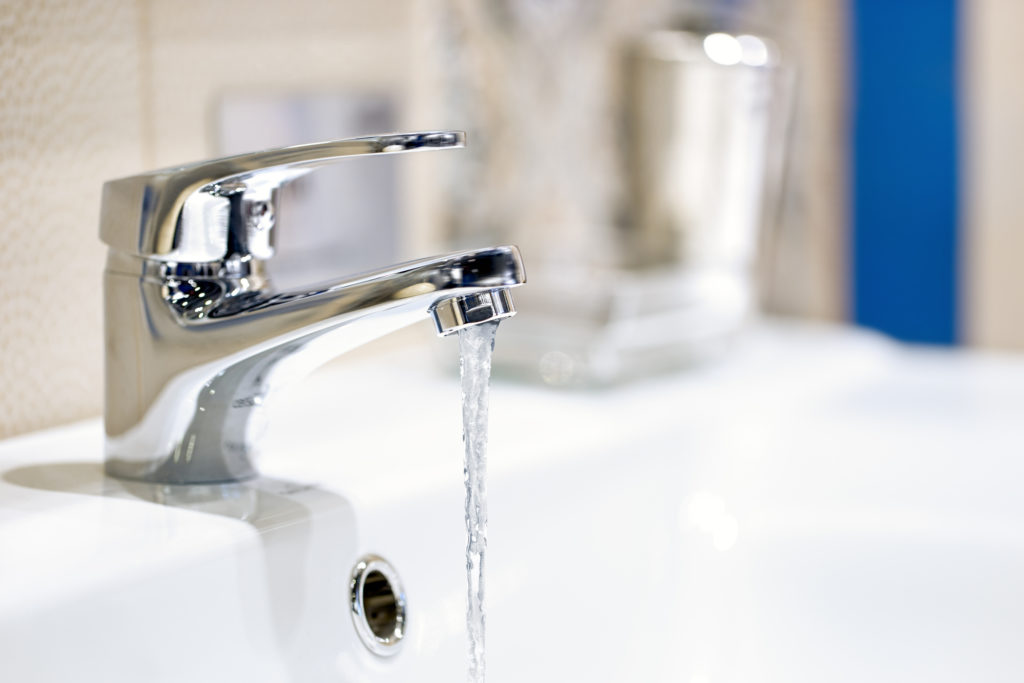 winterize pipes by draining water from faucets